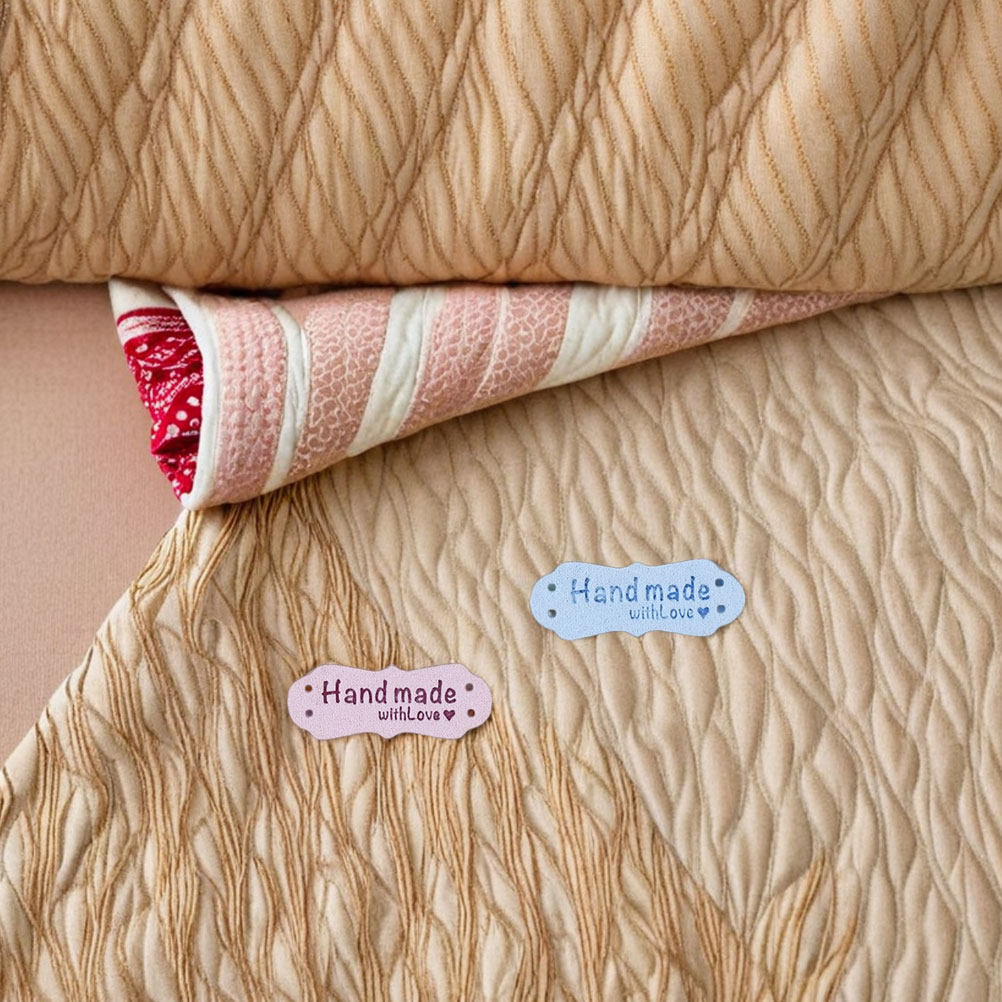 Sewing Label - 100 قطعة من ملصقات الملابس اليدوية